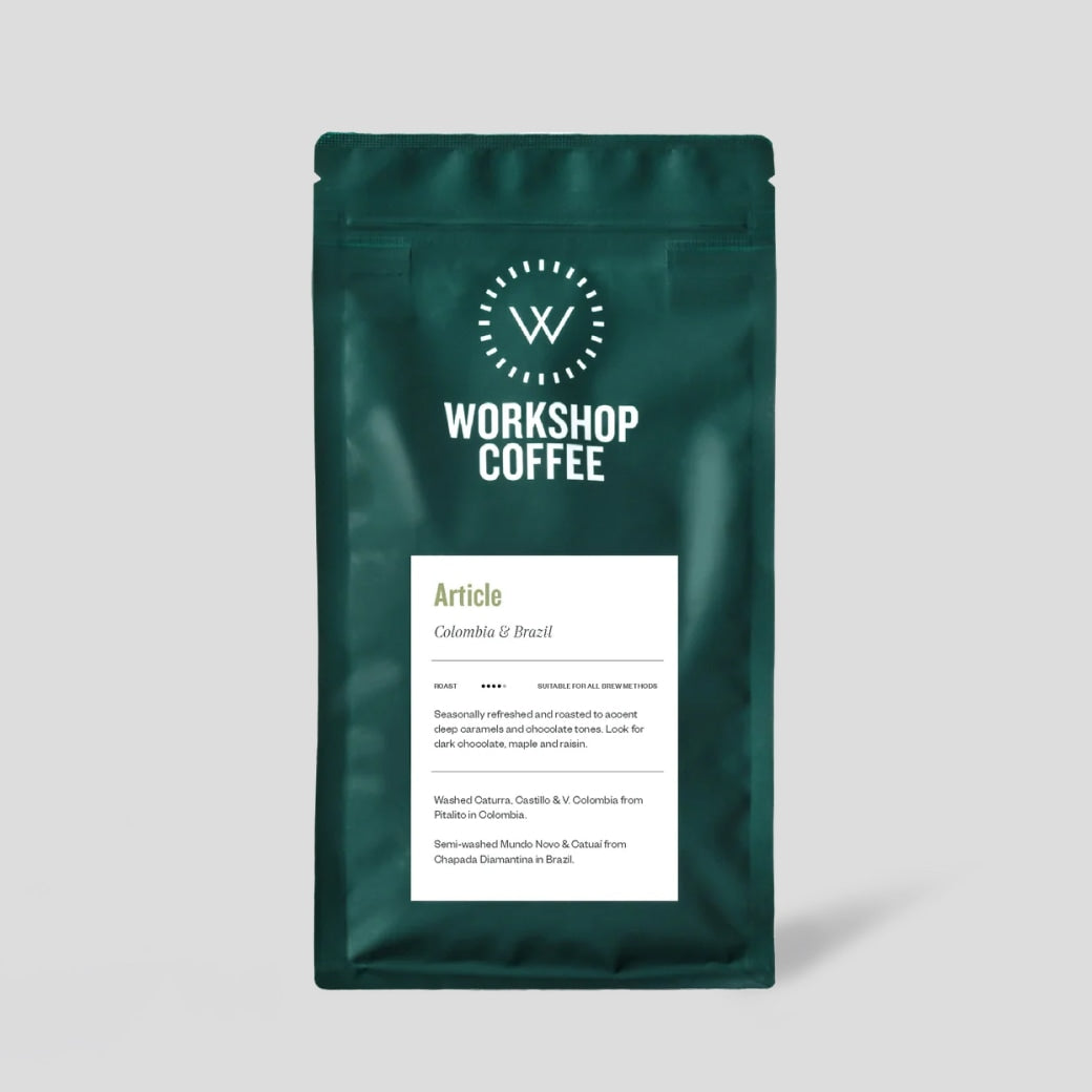 Article coffee beans by Workshop Coffee. Package on a beige background.
